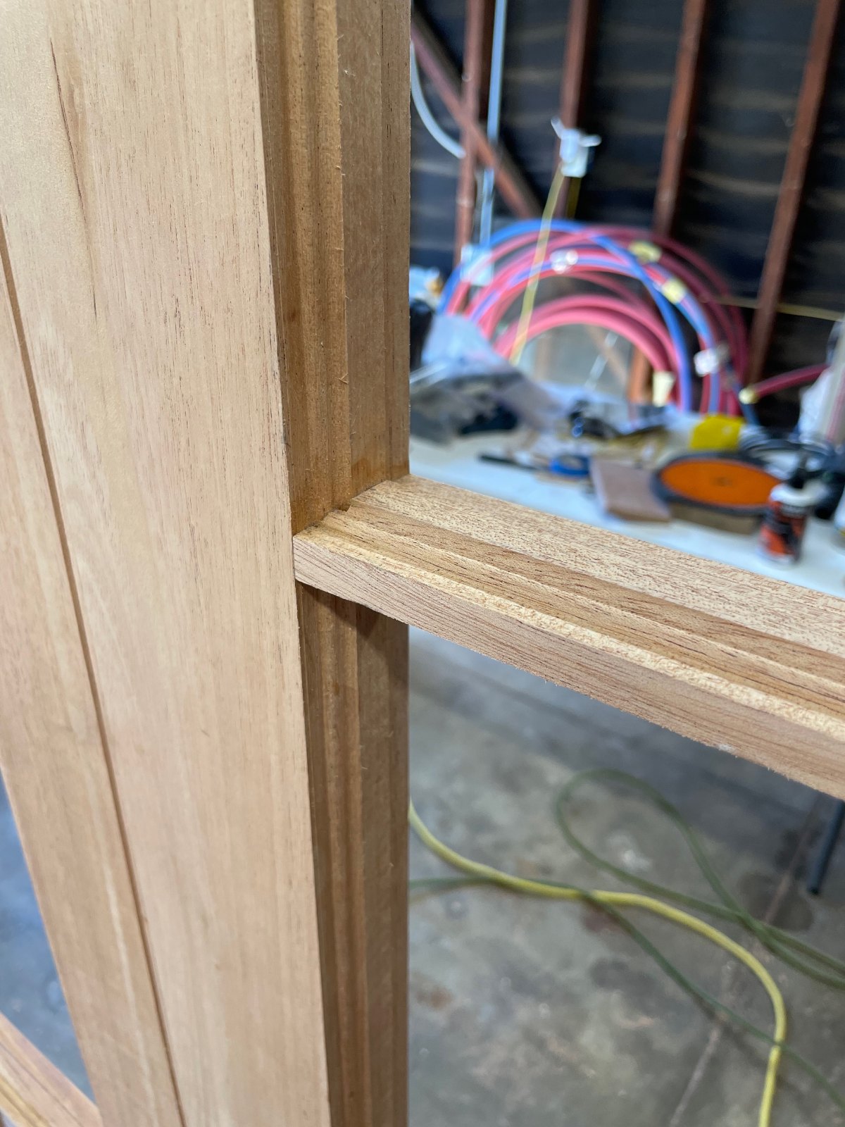 Custom wood joinery detail on divided-light door