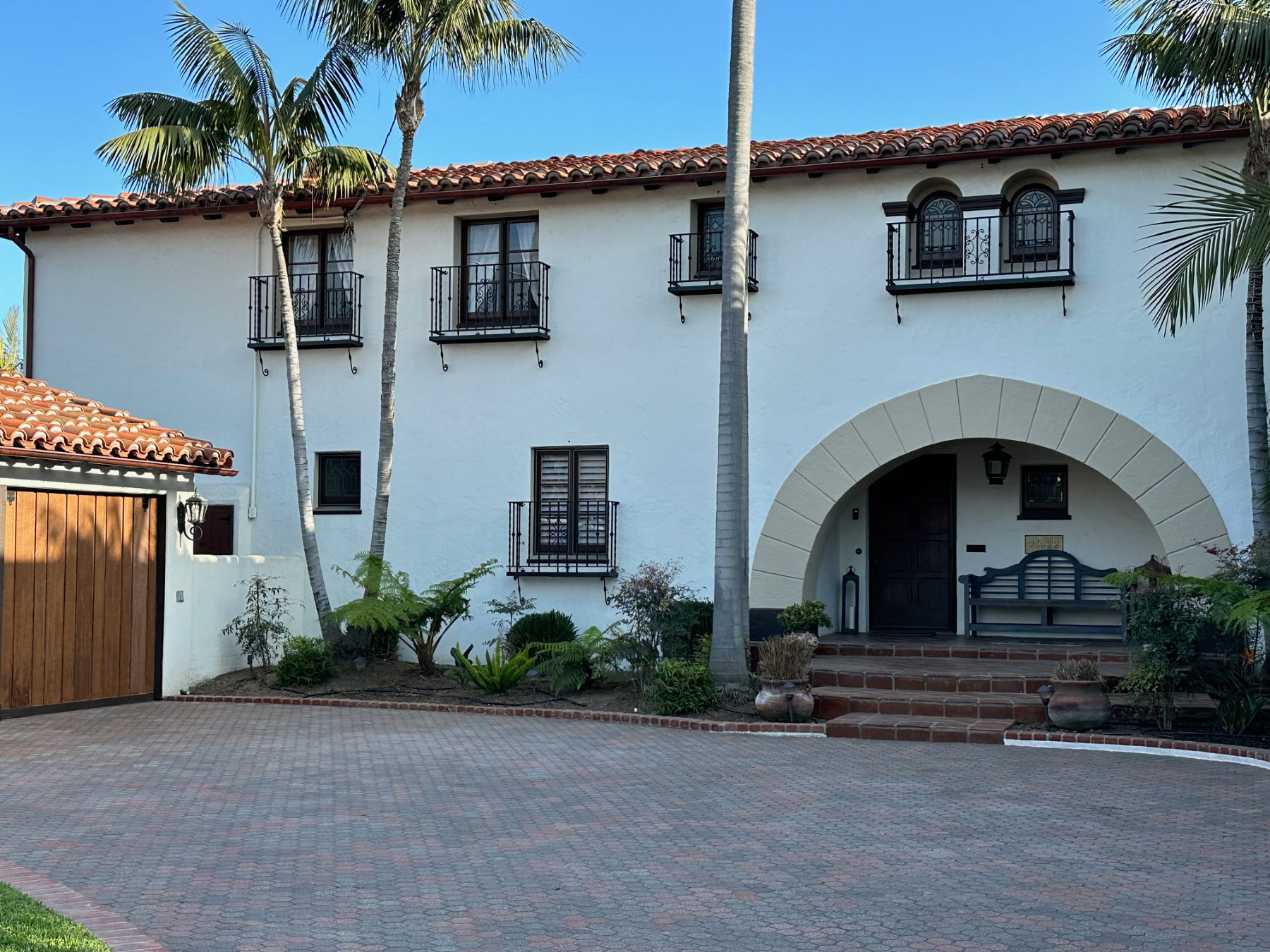Custom wrought iron balconies on Spanish style home