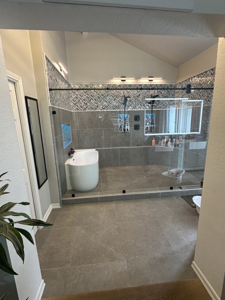 Glass enclosure detail in custom wet room